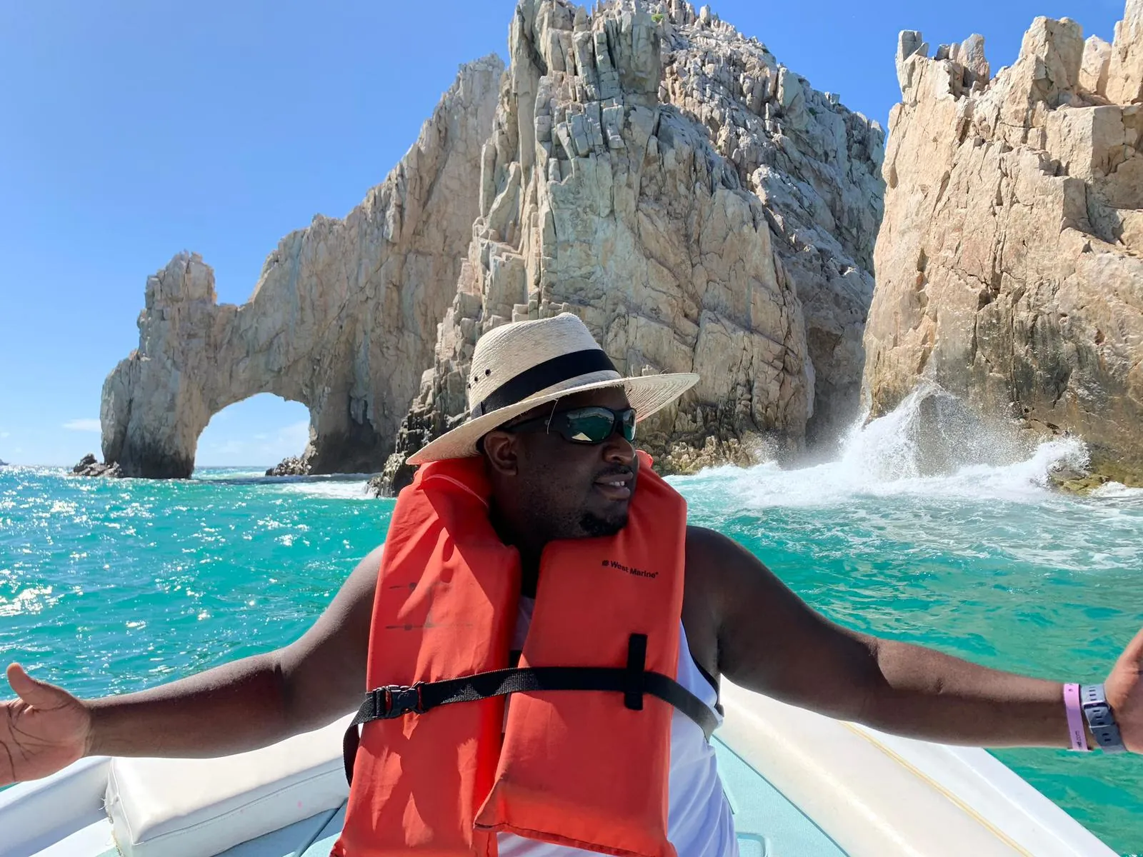 Asong in a life jacket on a boat tour at El Arco, Cabo San Lucas