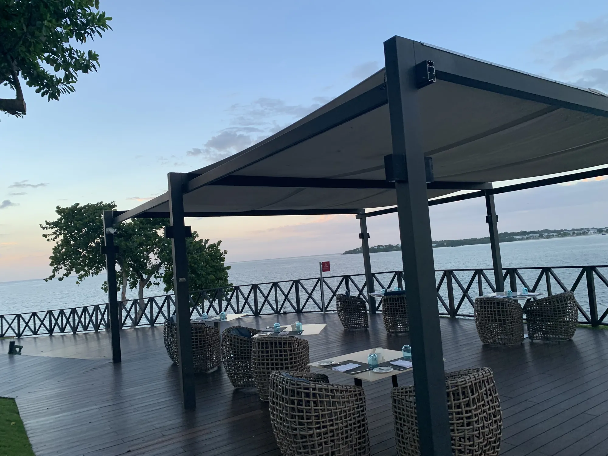 A seaside terrace pergola in Negril at blue hour